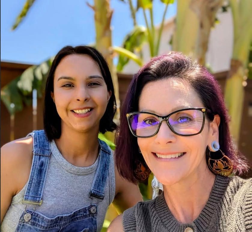 The two moms who run Grow & Learn at My Pace, smiling together outdoors